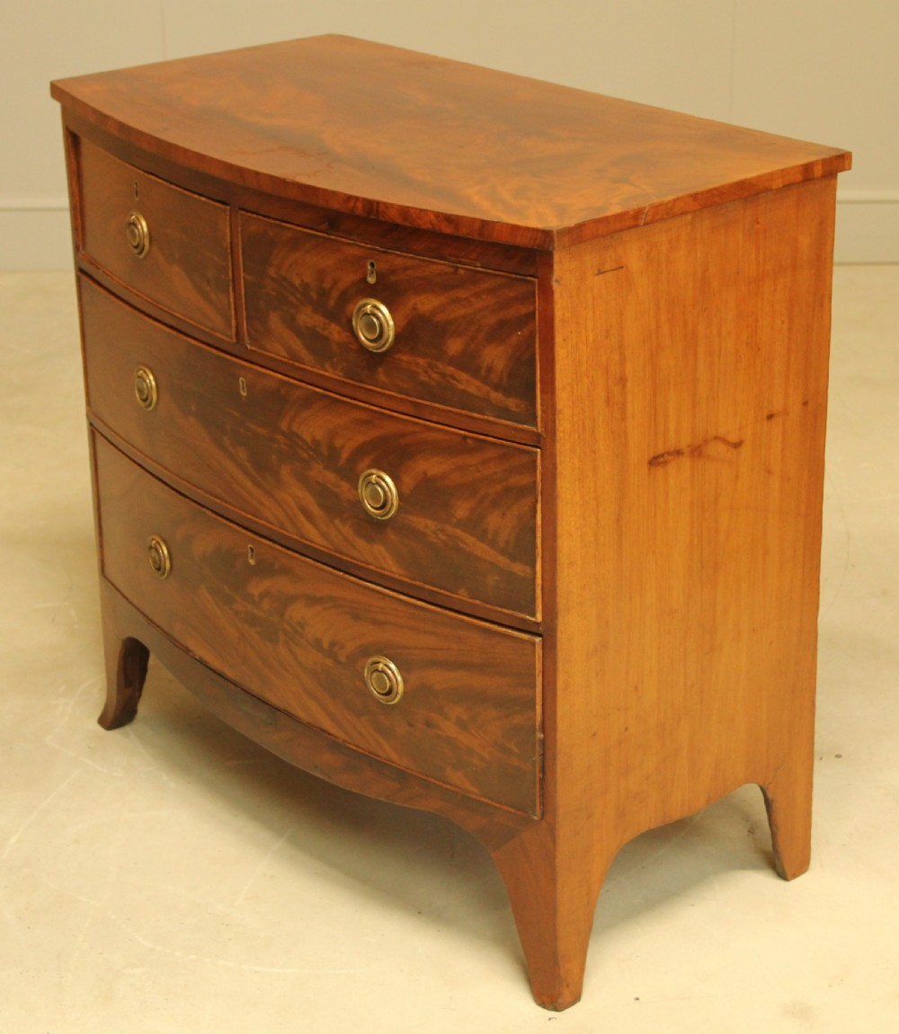 A Regency bow front chest of drawers. View VII