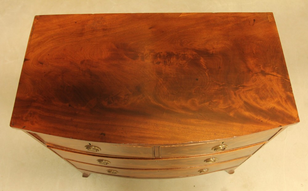 A Regency bow front chest of drawers. View IX