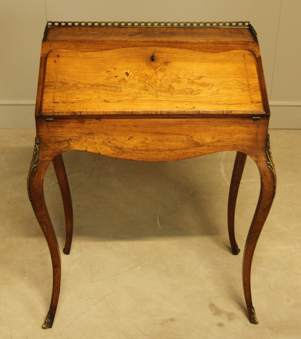 A 19th century rosewood bureau de dame