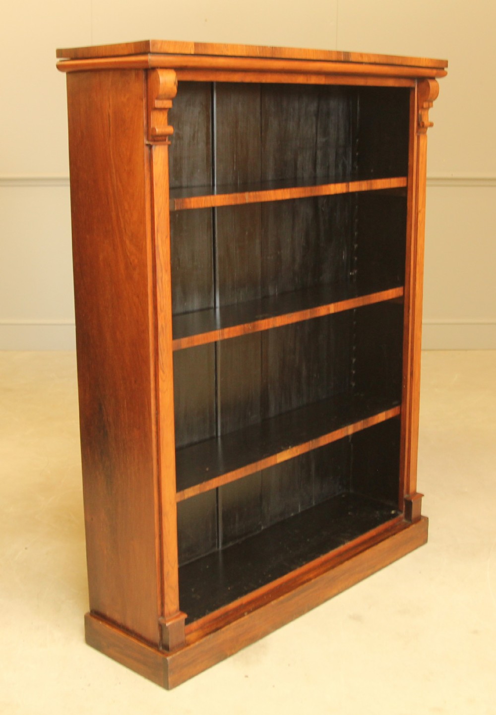 A VICTORIAN ROSEWOOD OPEN BOOKCASE