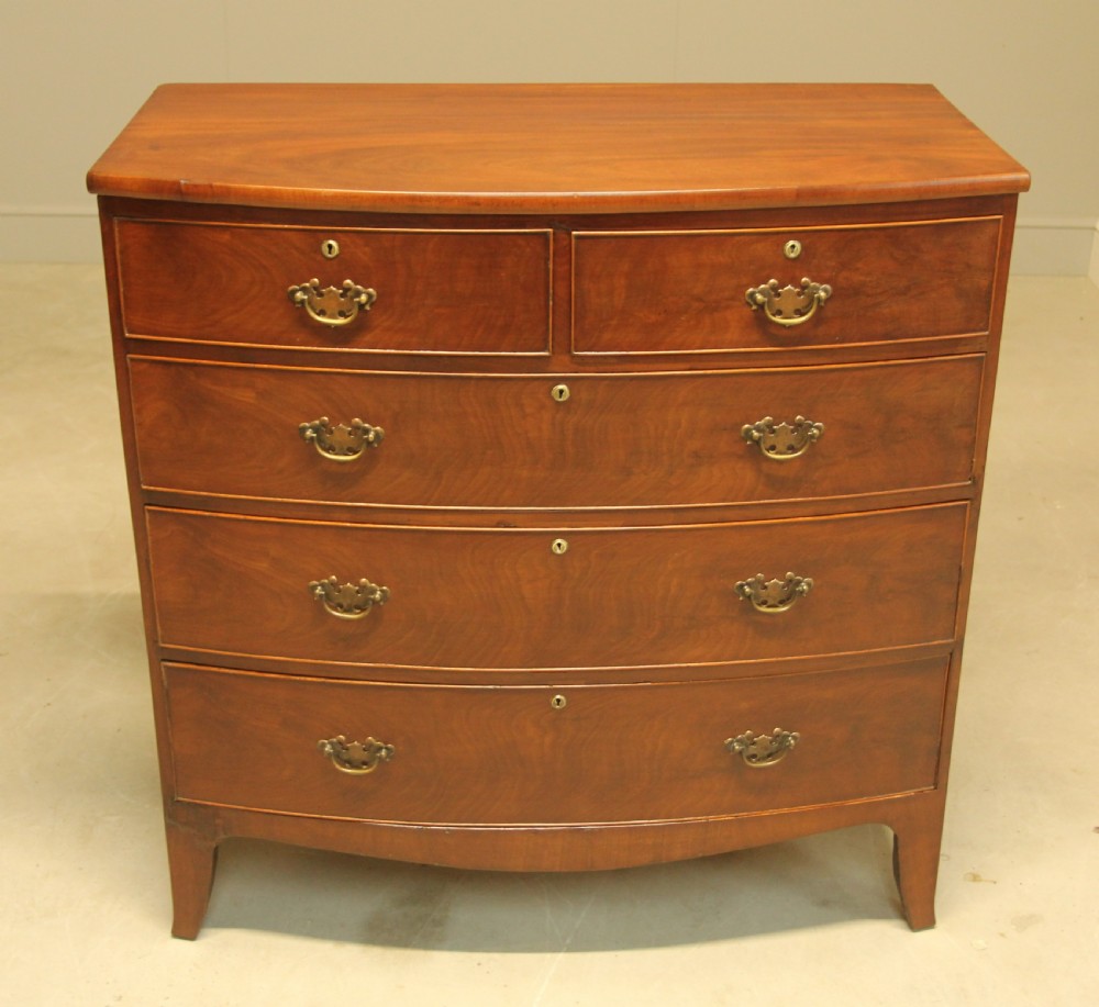 A REGENCY MAHOGANY BOW FRONTED CHEST OF DRAWERS View II
