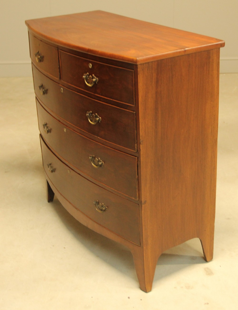 A REGENCY MAHOGANY BOW FRONTED CHEST OF DRAWERS View VI