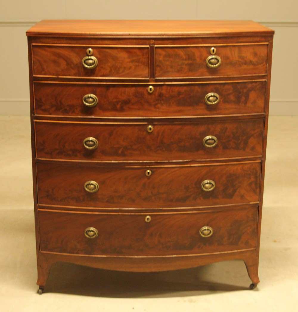 A REGENCY MAHOGANY BOWFRONT CHEST OF DRAWERS View II