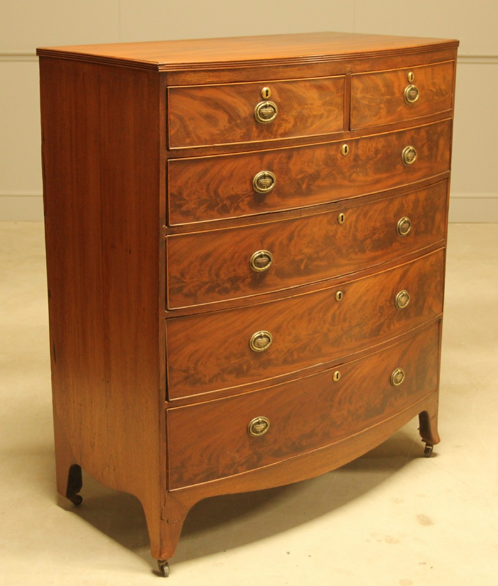 A REGENCY MAHOGANY BOWFRONT CHEST OF DRAWERS View III