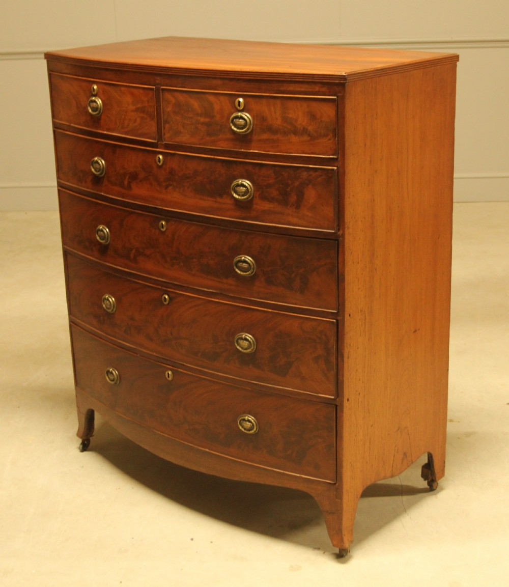 A REGENCY MAHOGANY BOWFRONT CHEST OF DRAWERS View IV