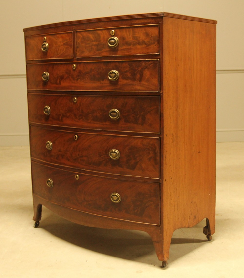 A REGENCY MAHOGANY BOWFRONT CHEST OF DRAWERS View VI