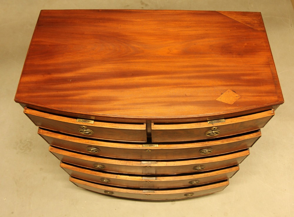 A REGENCY MAHOGANY BOWFRONT CHEST OF DRAWERS View VII