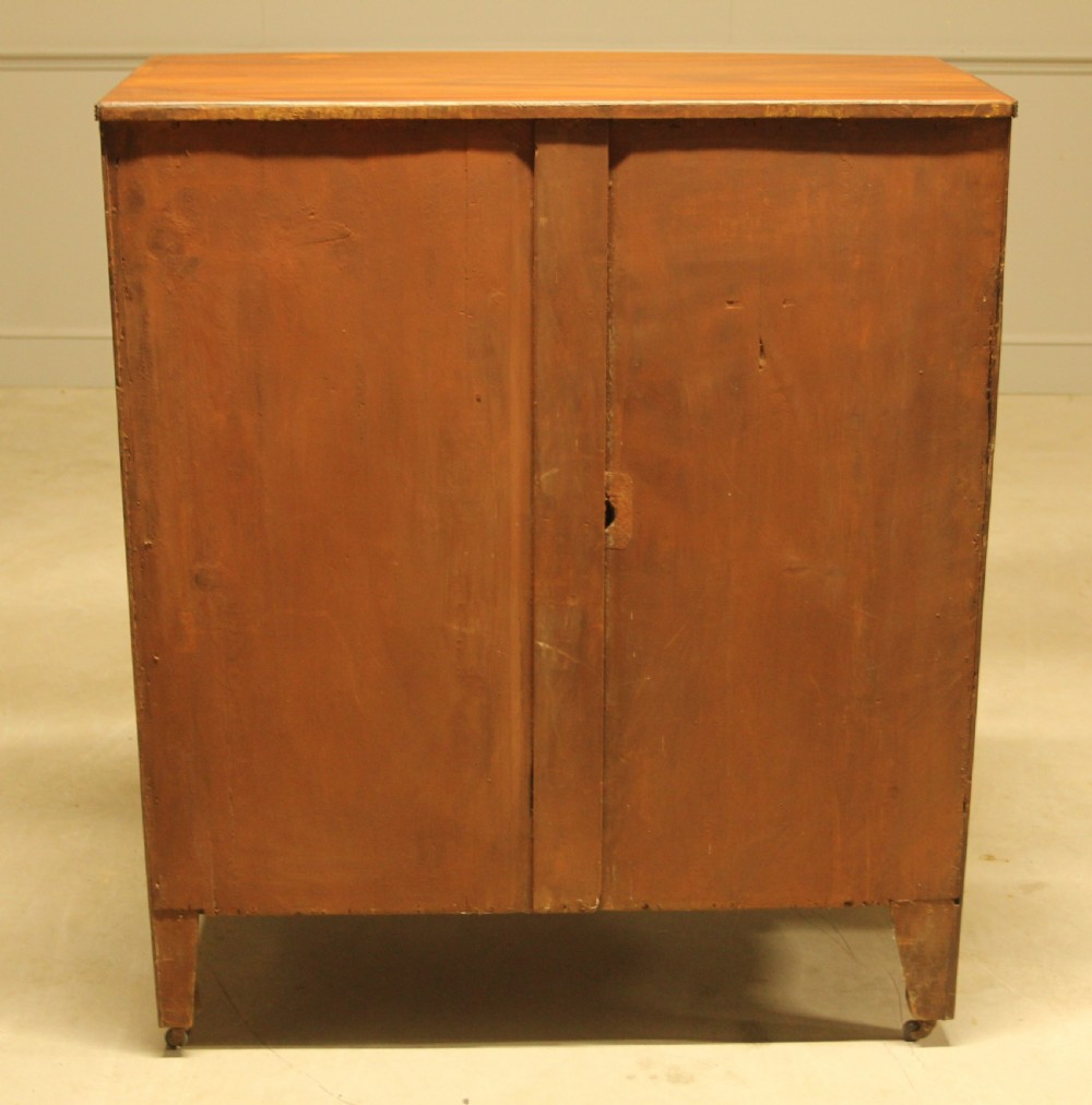 A REGENCY MAHOGANY BOWFRONT CHEST OF DRAWERS View VIII