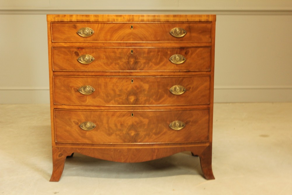 A 19TH CENTURY BOW FRONTED CHEST OF DRAWERS View II