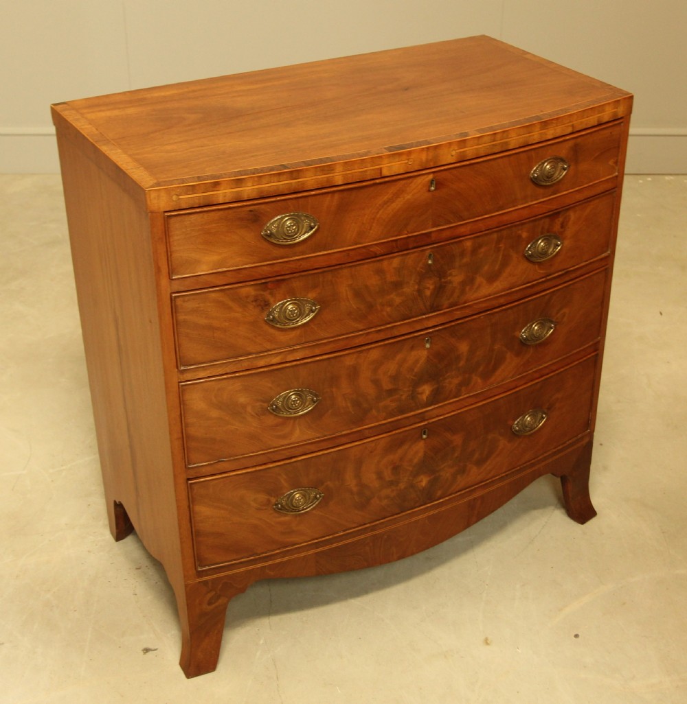 A 19TH CENTURY BOW FRONTED CHEST OF DRAWERS View IV