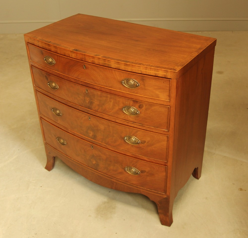 A 19TH CENTURY BOW FRONTED CHEST OF DRAWERS View V