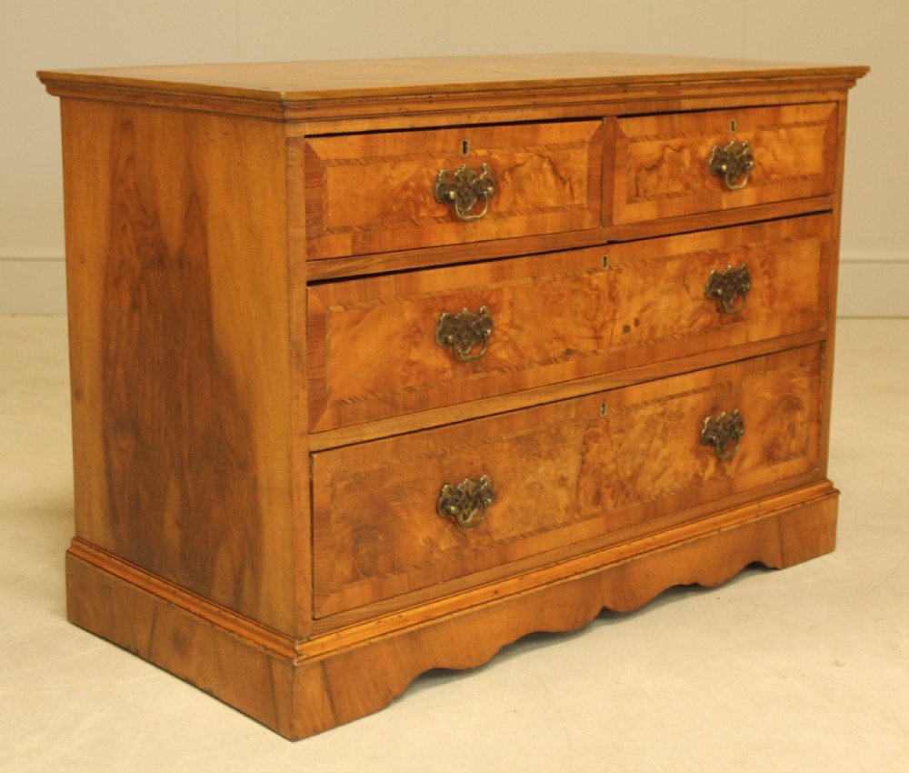 A BURR WALNUT CHEST OF DRAWERS View V