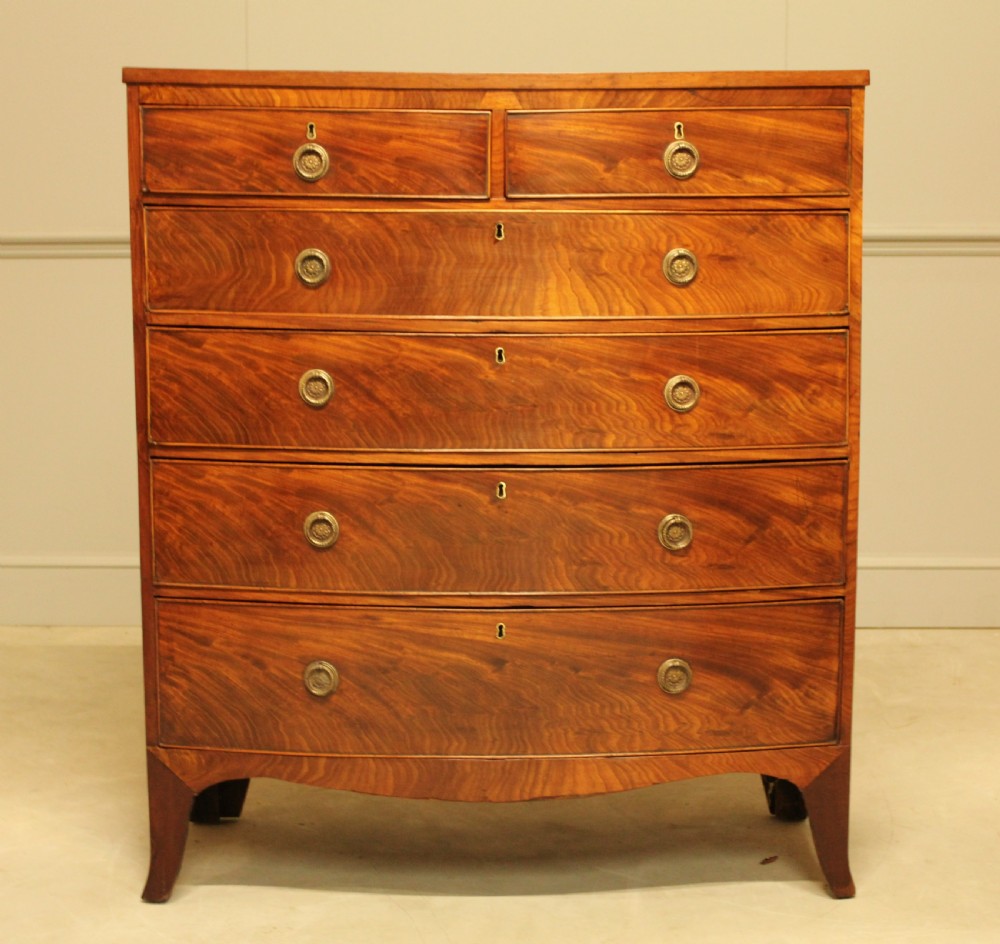 A 19th century bow fronted chest of drawers View II
