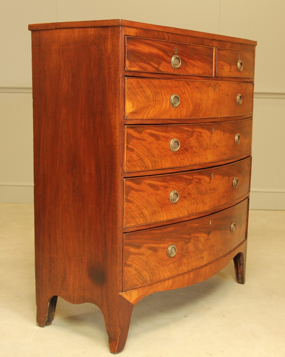 A 19th century bow fronted chest of drawers View V