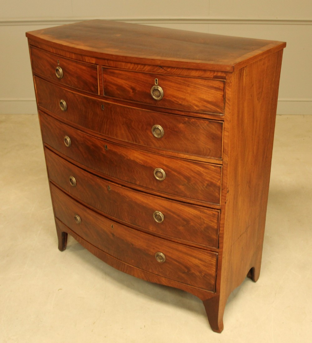 A 19th century bow fronted chest of drawers View VI