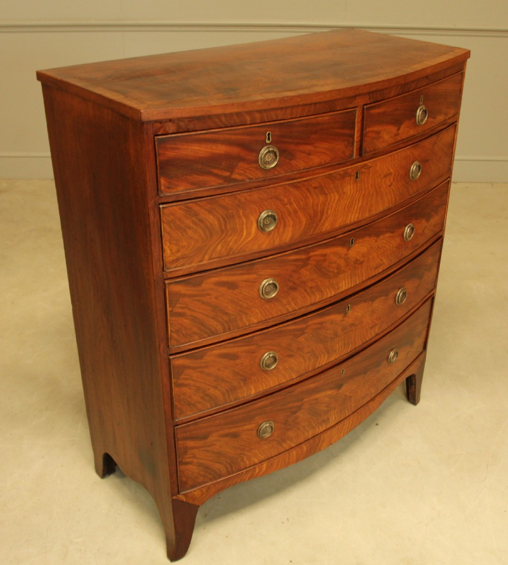 A 19th century bow fronted chest of drawers View VII