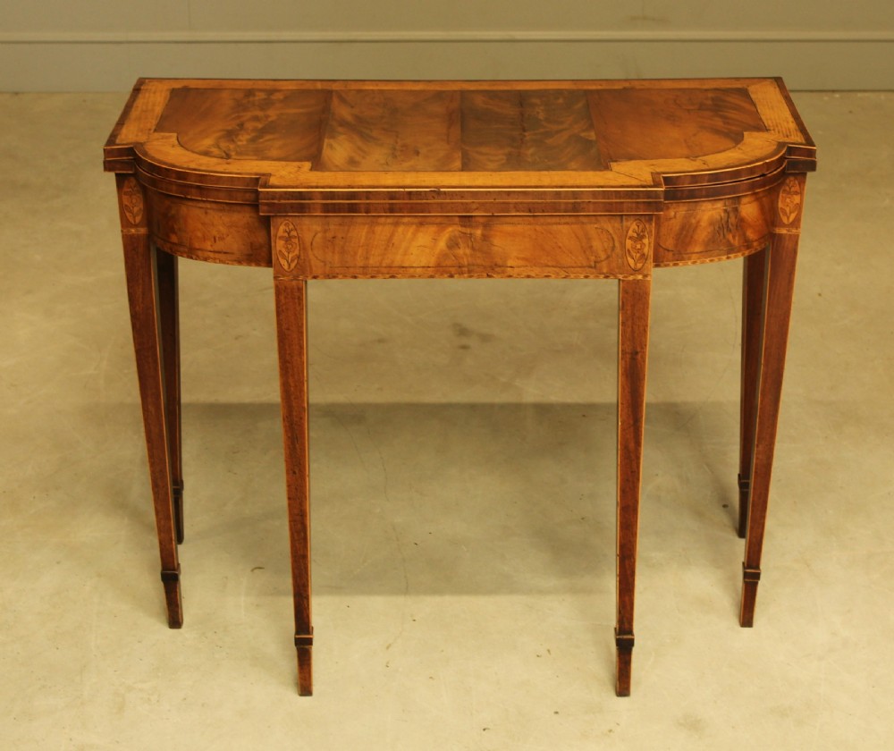 A Sheraton period mahogany breakfront card table. 