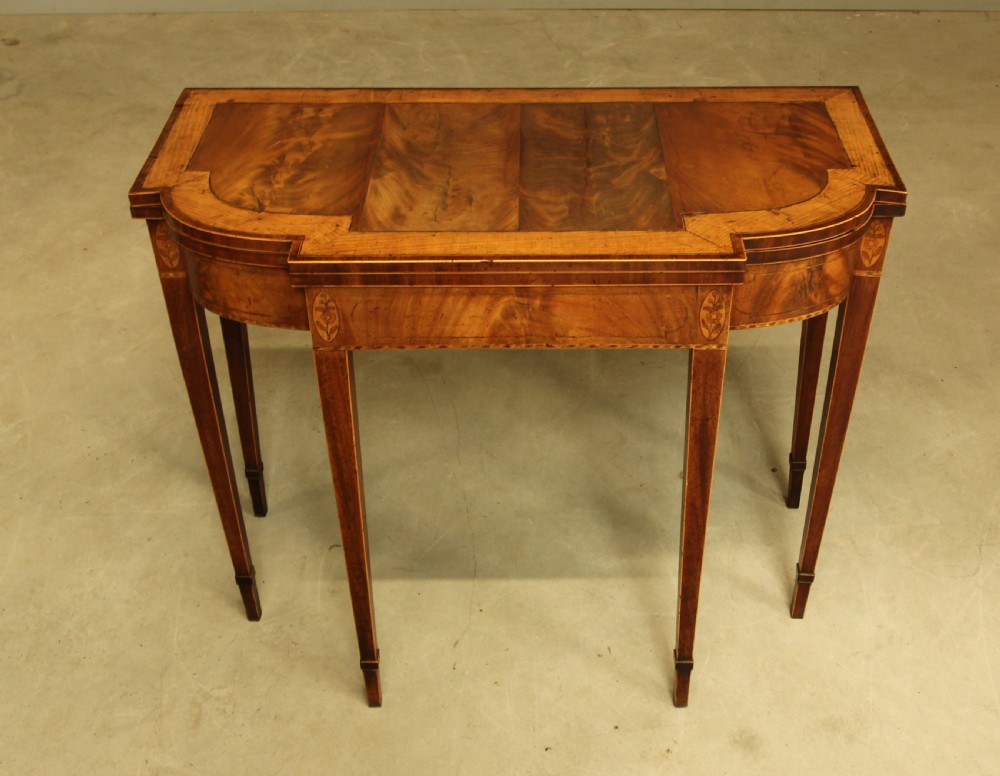 A Sheraton period mahogany breakfront card table.  View II