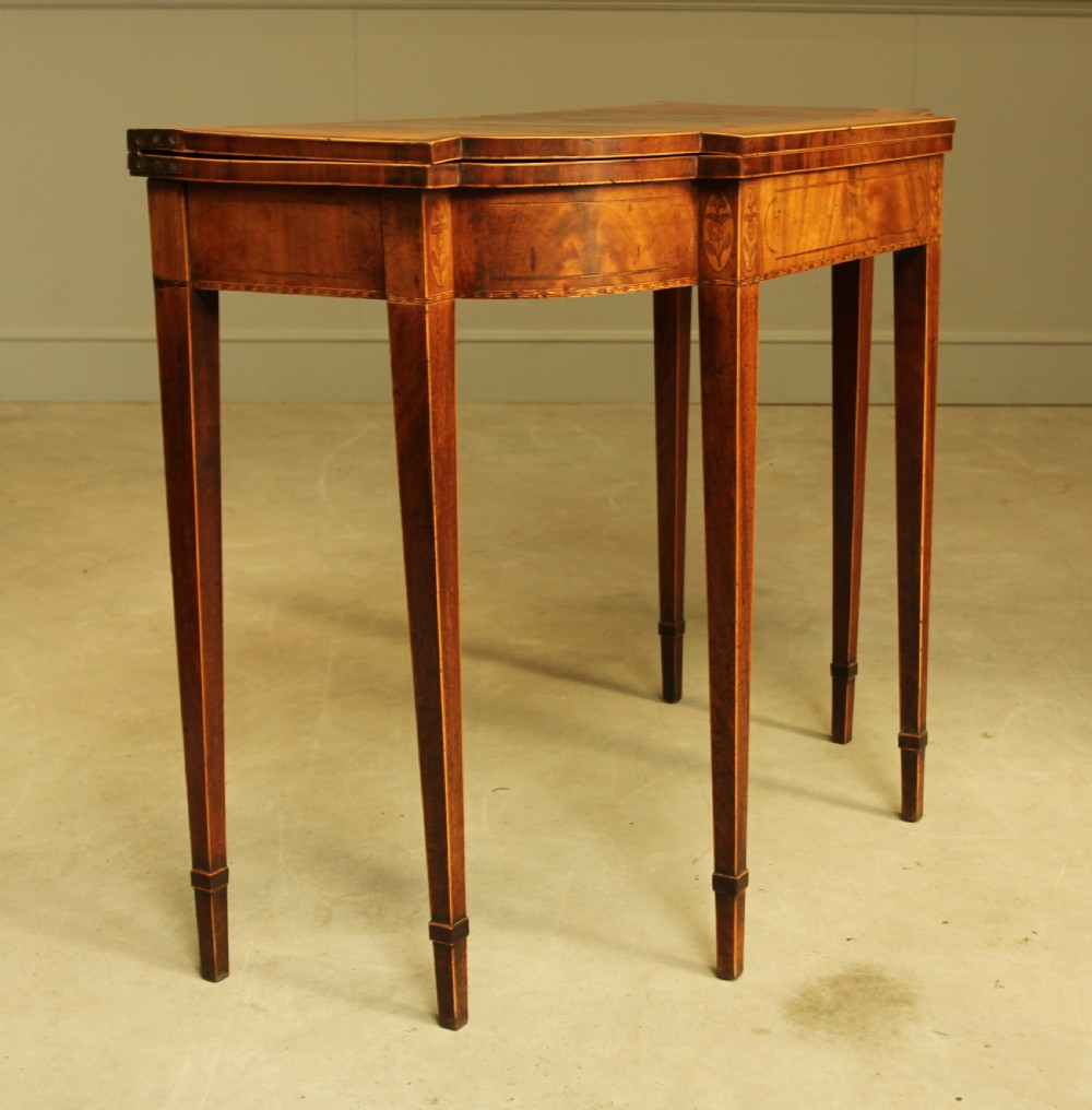 A Sheraton period mahogany breakfront card table.  View IV