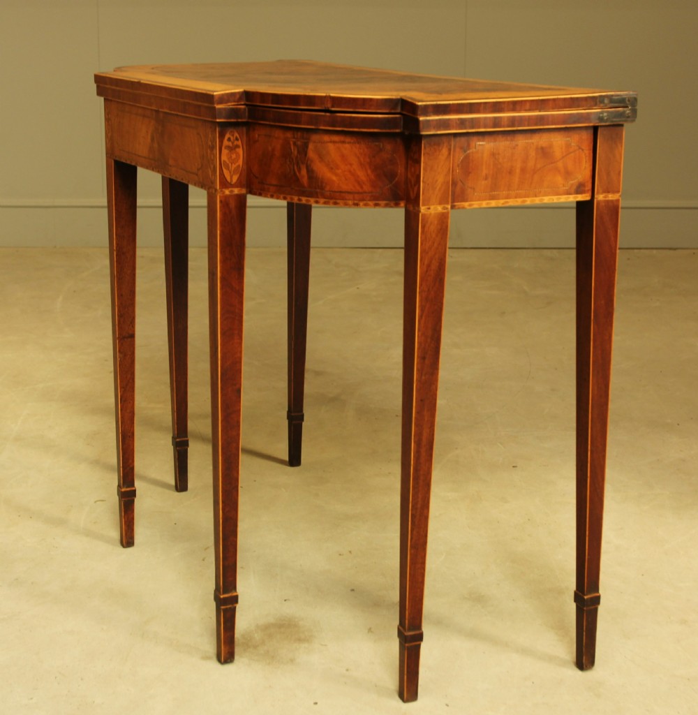 A Sheraton period mahogany breakfront card table.  View V