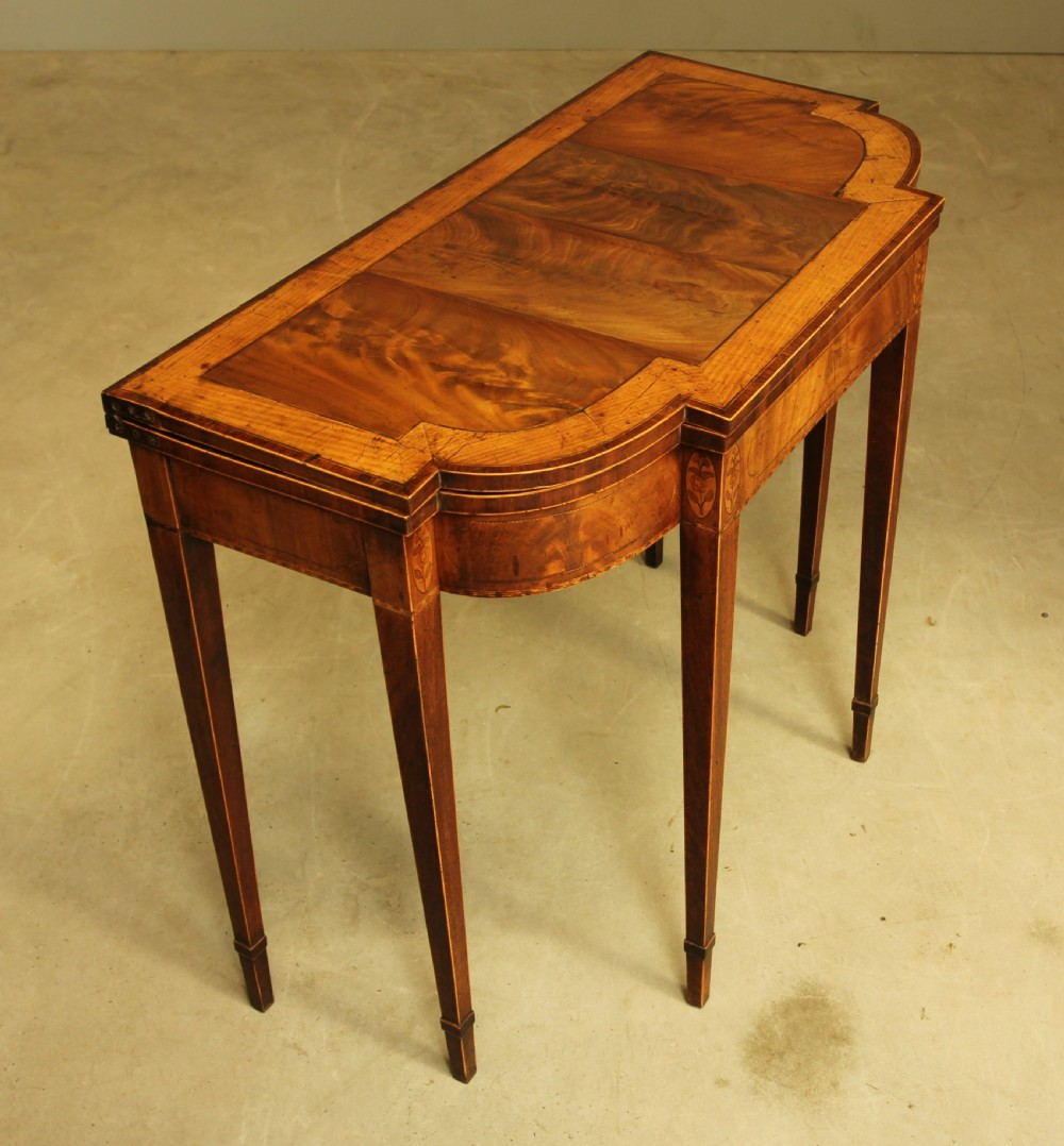 A Sheraton period mahogany breakfront card table.  View VI