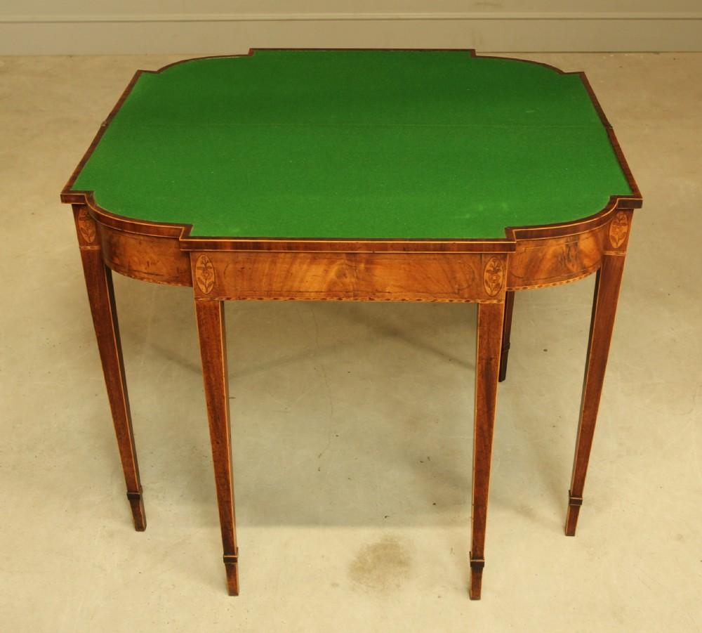 A Sheraton period mahogany breakfront card table.  View IX