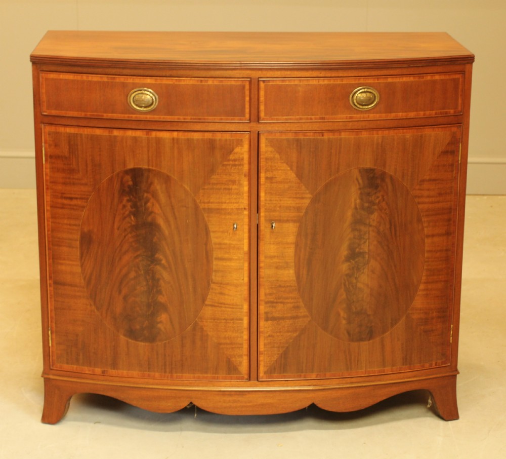A TWO DOOR BOW FRONTED SIDEBOARD View II