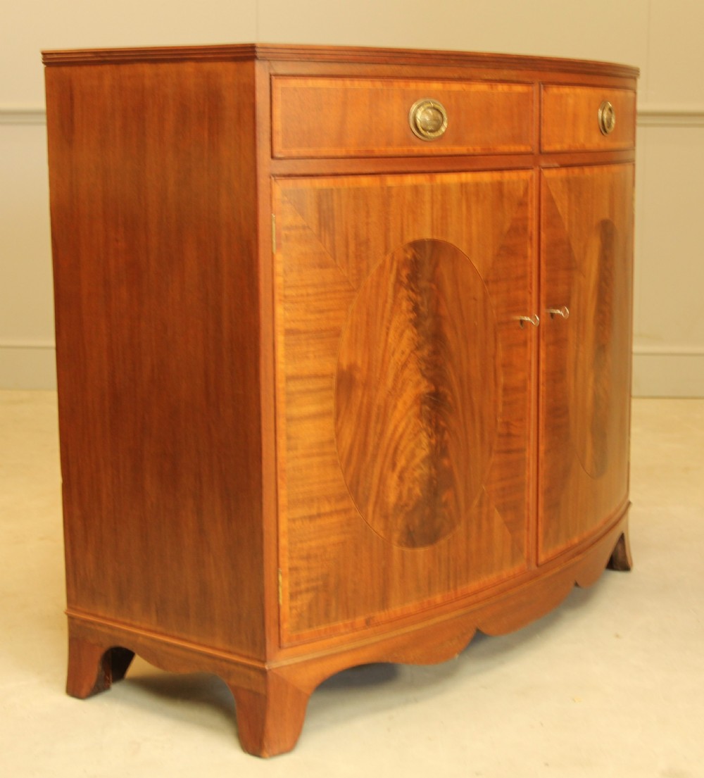 A TWO DOOR BOW FRONTED SIDEBOARD View IV