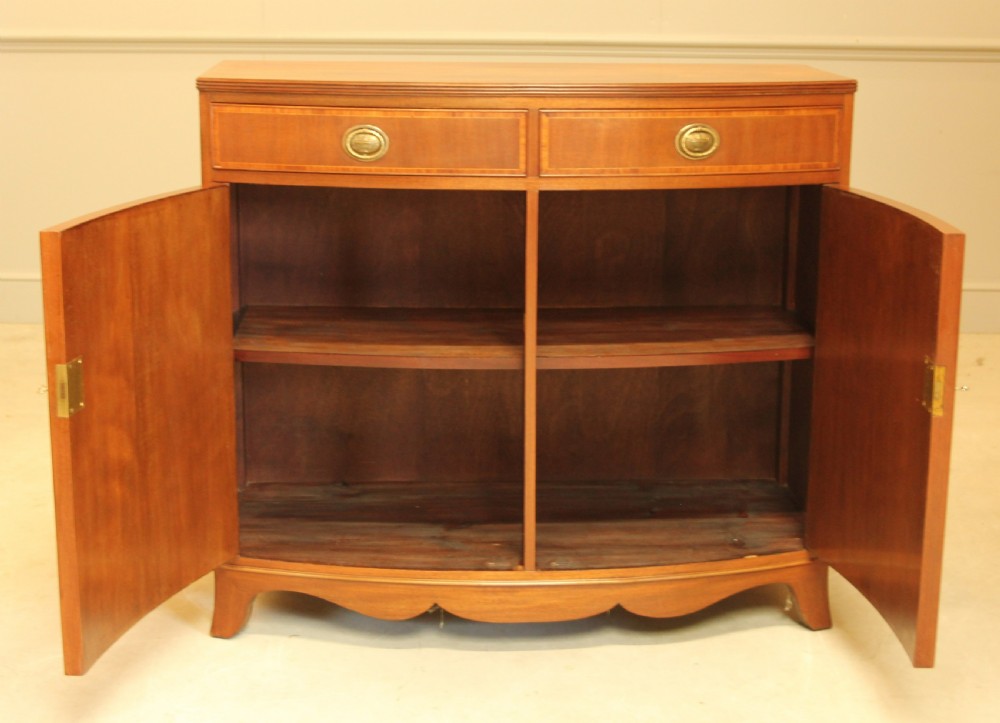 A TWO DOOR BOW FRONTED SIDEBOARD View VIII