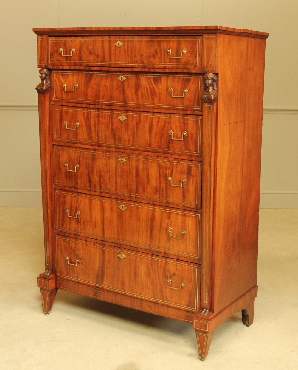 An 19th century French brass inlay mahogany chest of drawers.  View IV
