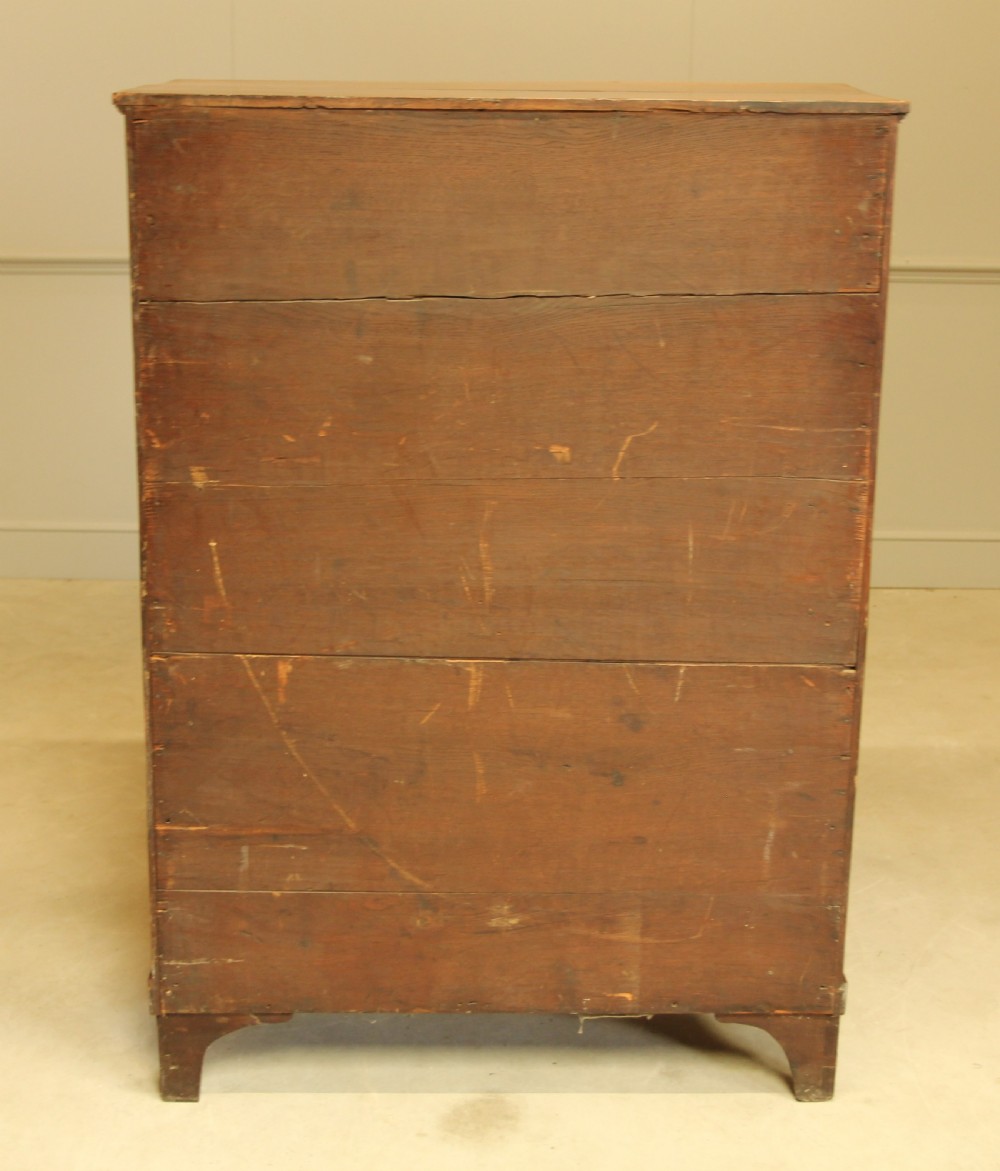 An 19th century French brass inlay mahogany chest of drawers.  View XIV