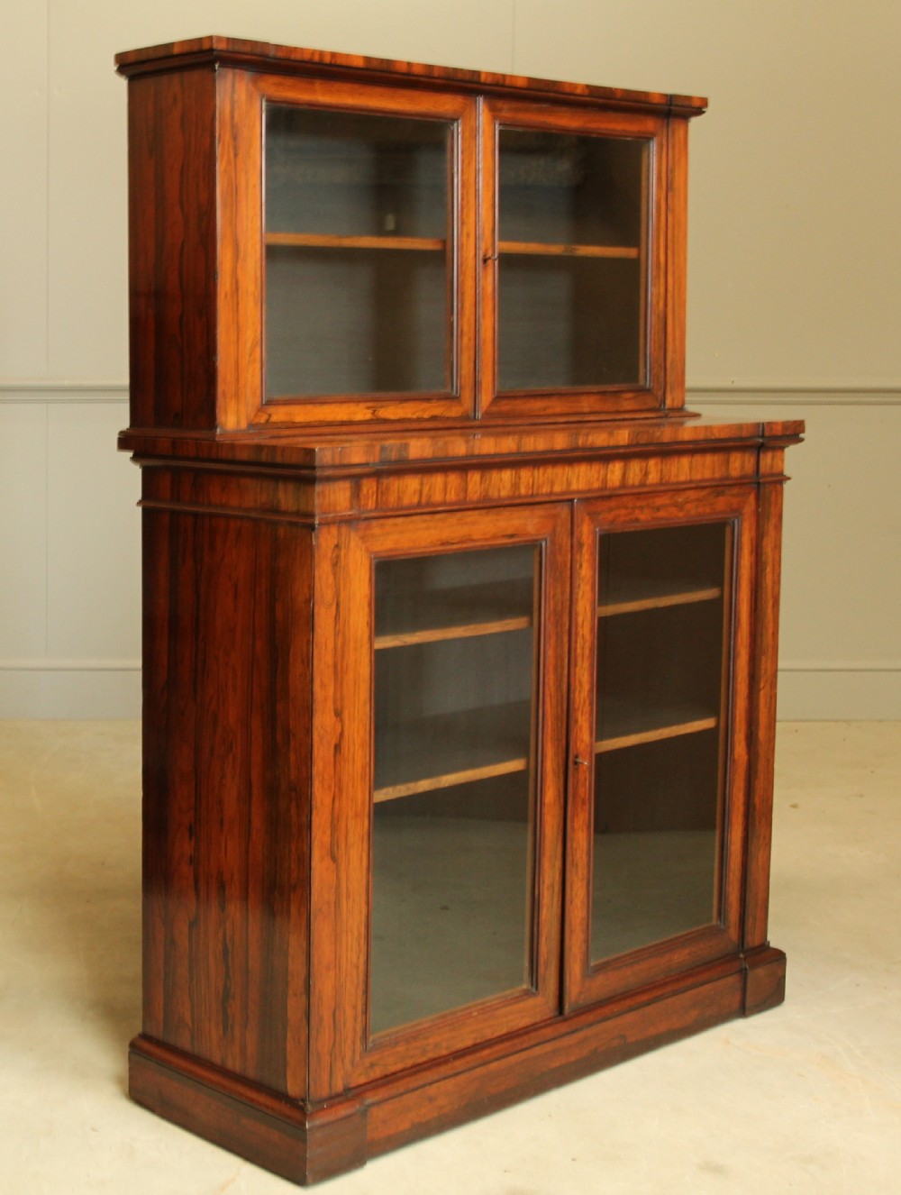 An early 19th century Rosewood bookcase display