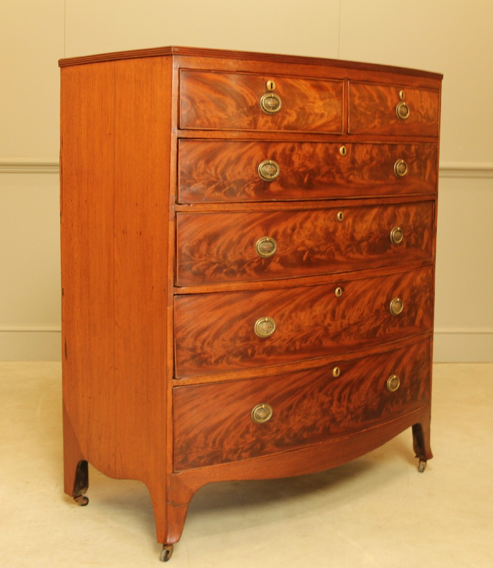 A Regency mahogany bow fronted chest of drawers. View II