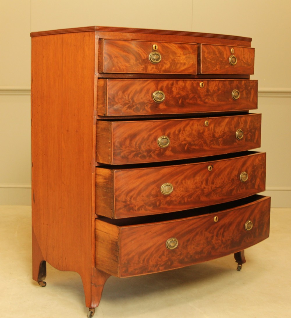 A Regency mahogany bow fronted chest of drawers. View IV