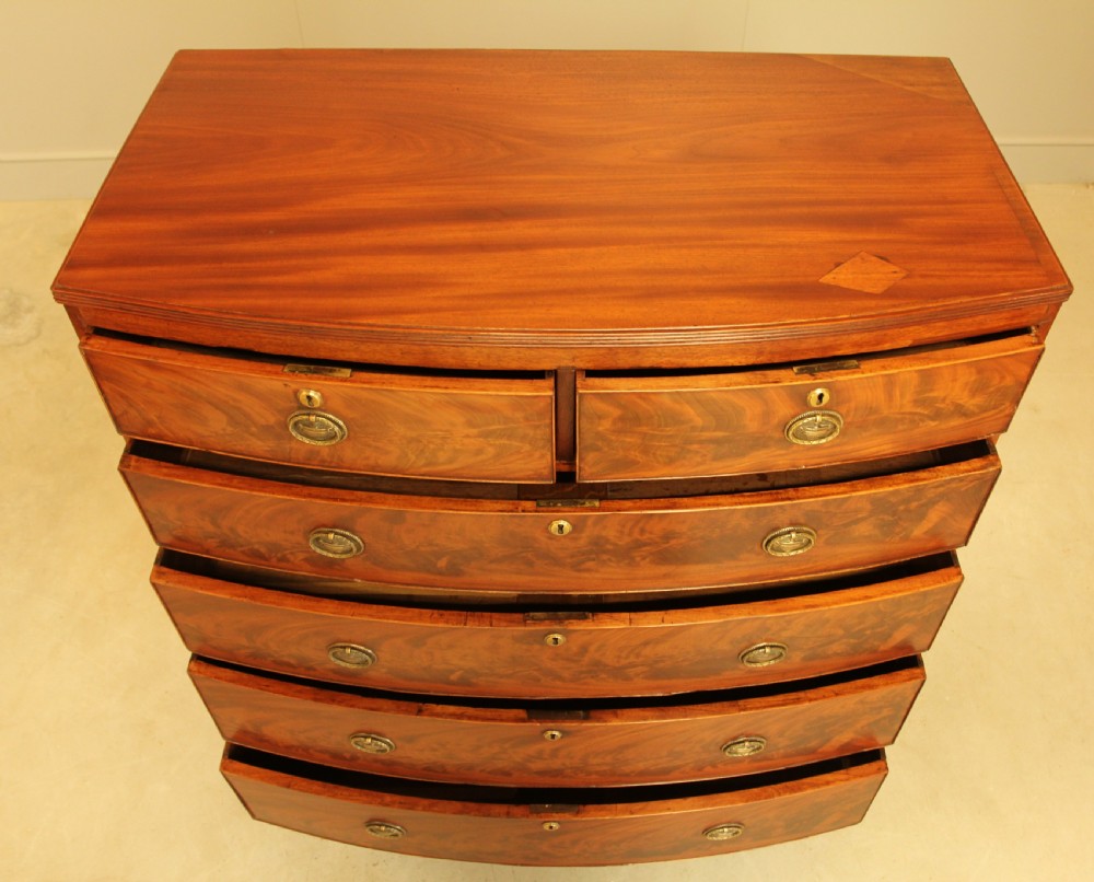 A Regency mahogany bow fronted chest of drawers. View VI