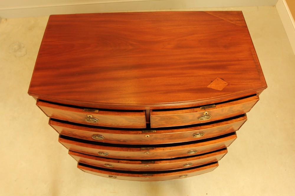 A Regency mahogany bow fronted chest of drawers. View VII