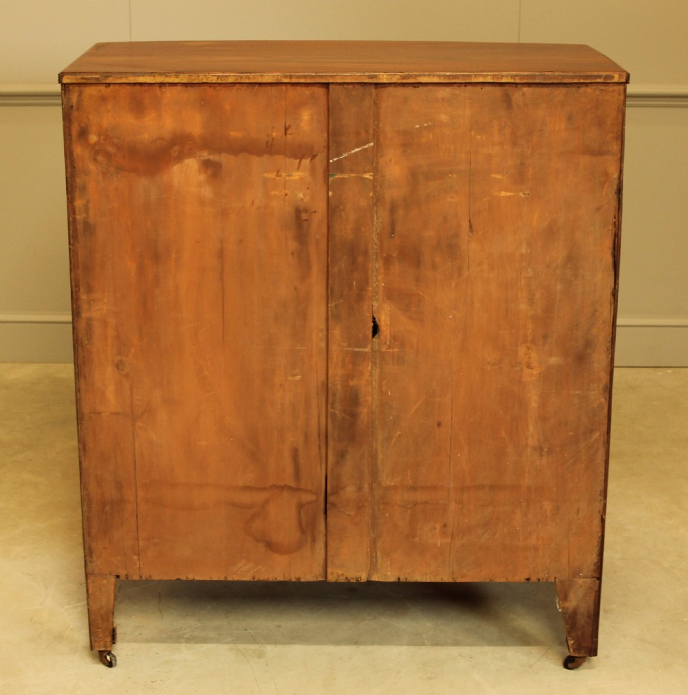 A Regency mahogany bow fronted chest of drawers. View IX