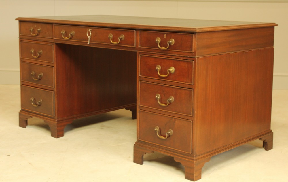 A LARGE MAHOGANY TWIN PEDISTAL DESK View IV
