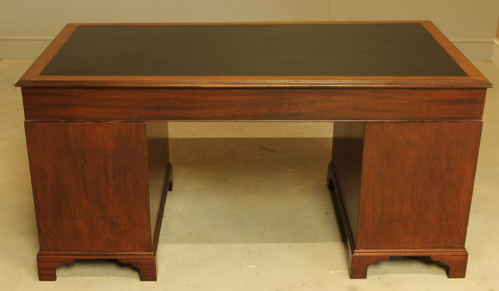 A LARGE MAHOGANY TWIN PEDISTAL DESK View X