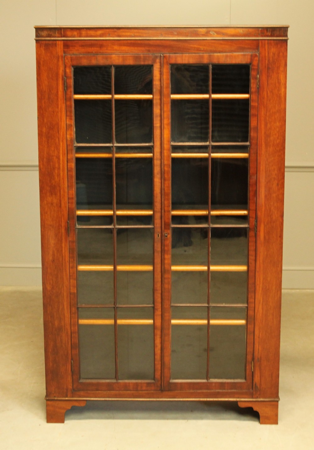 A 19TH CENTURY MAHOGANY GLAZED BOOKCASE.