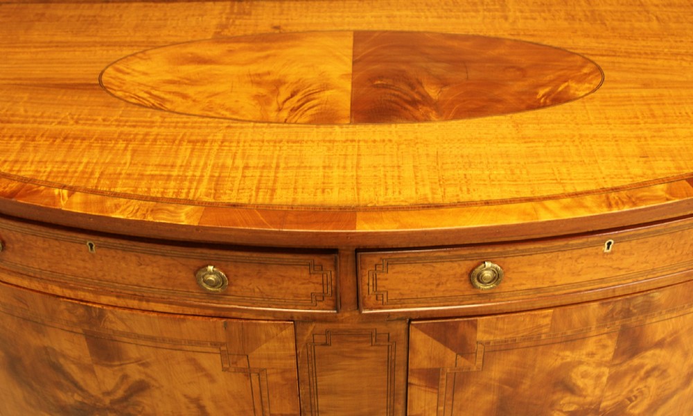 AN EDWARDIAN SATINWOOD BOW FRONTED TWO DOOR SIDEBOARD. View X