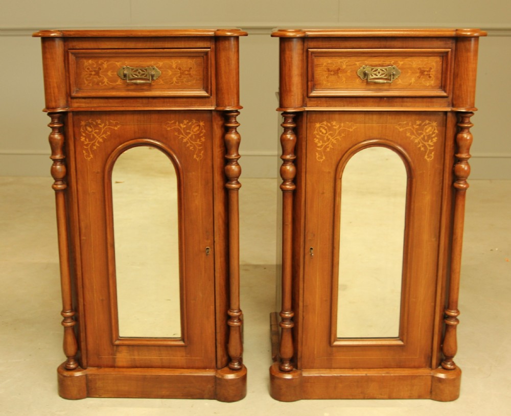 A LARGE PAIR OF WALNUT VICTORIAN BEDSIDE CABINETS