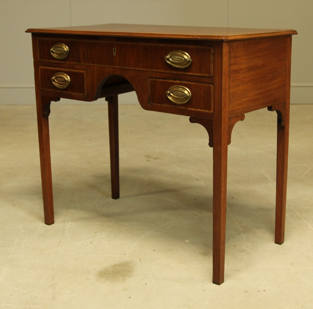 A 19th century mahogany kneehole side table.  View III