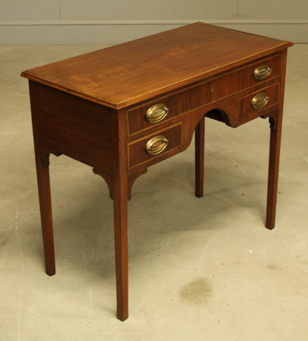 A 19th century mahogany kneehole side table.  View IV