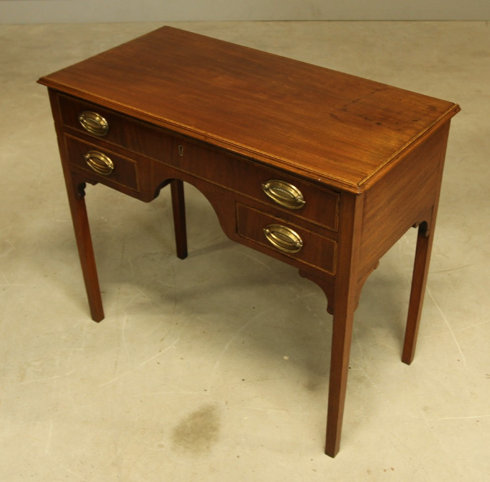 A 19th century mahogany kneehole side table.  View V