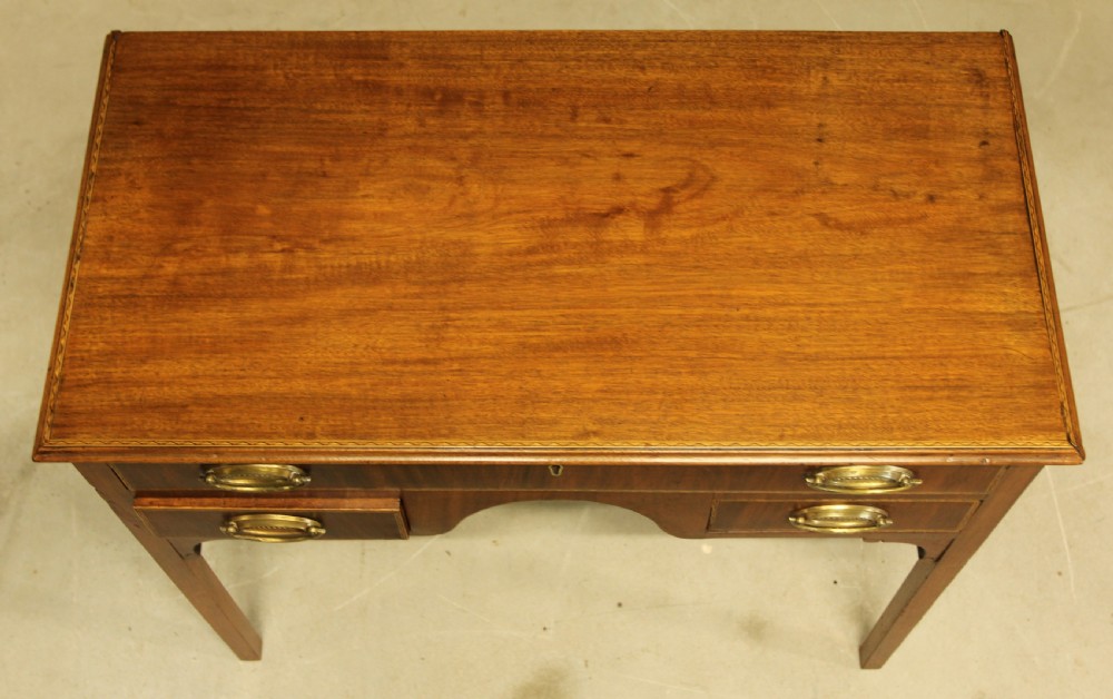 A 19th century mahogany kneehole side table.  View VI