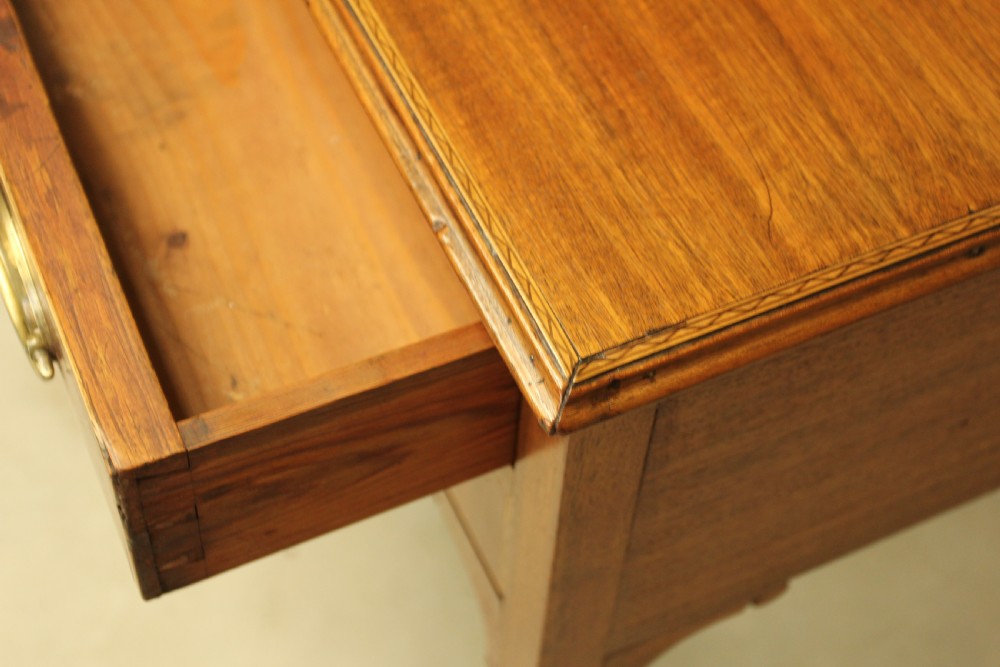 A 19th century mahogany kneehole side table.  View VII