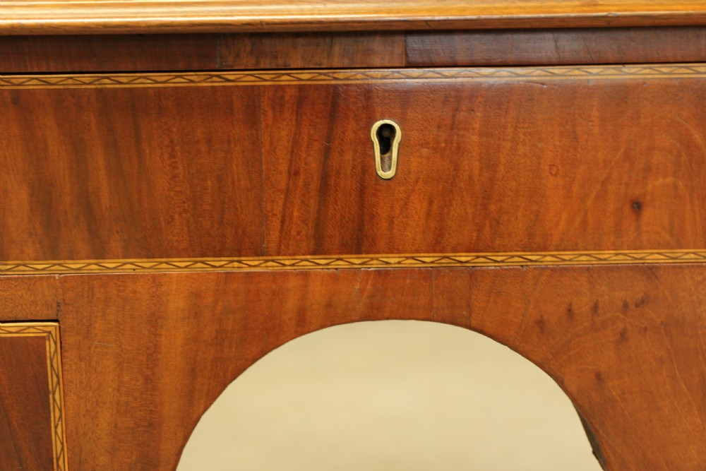 A 19th century mahogany kneehole side table.  View IX