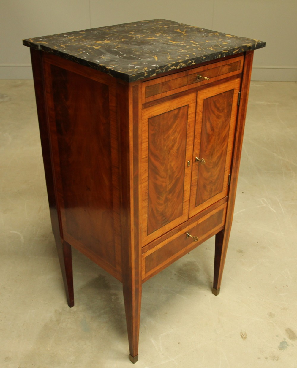 A French 19th century marble topped mahogany music cabinet. View VIII