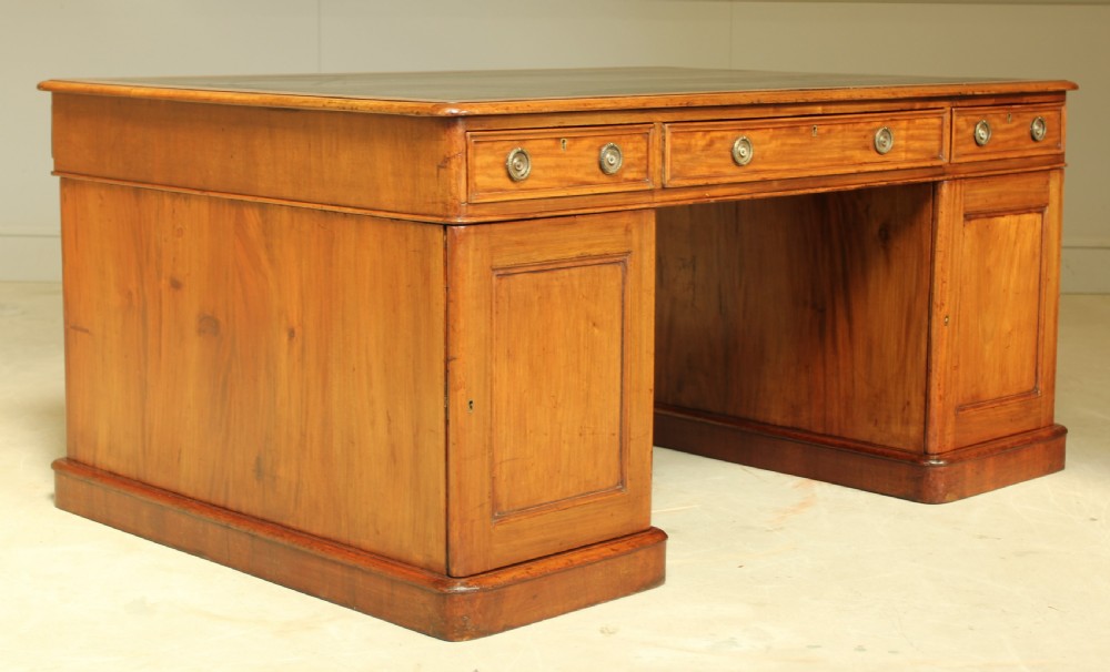A large Victorian mahogany partners desk.